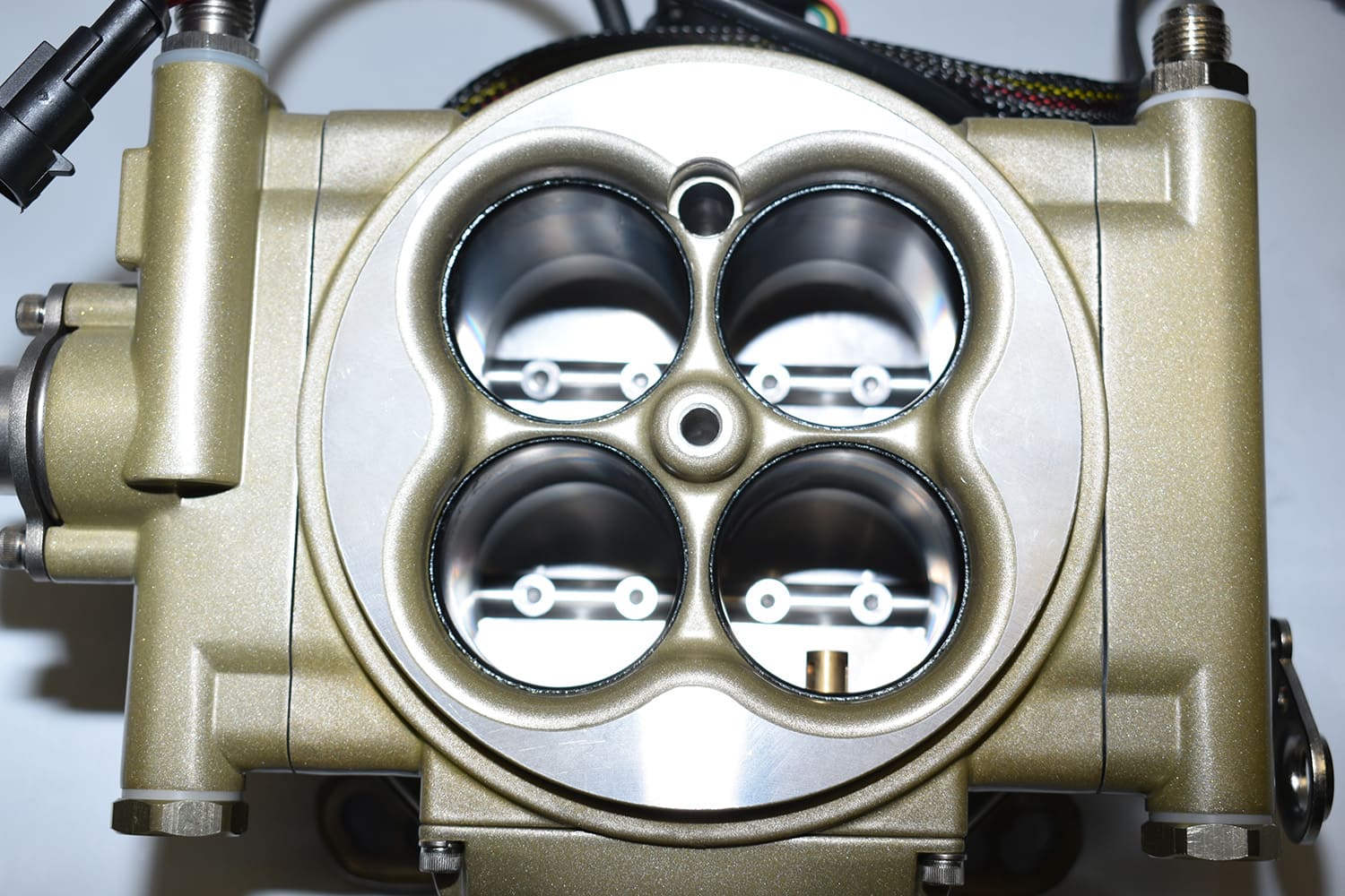 07 Top view of gold FiTech throttle body showing injectors inside venturis for atomization