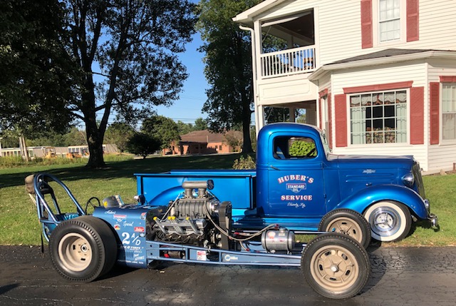 08 1937 chevy pickup beside a 1960 dragmaster