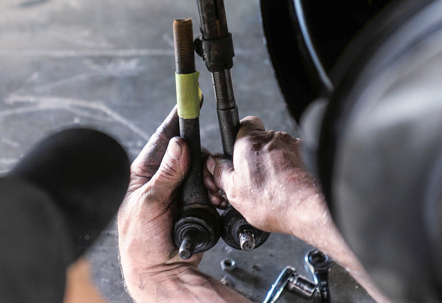 08 Comparing new tie rod end to old factory part during steering linkage refresh