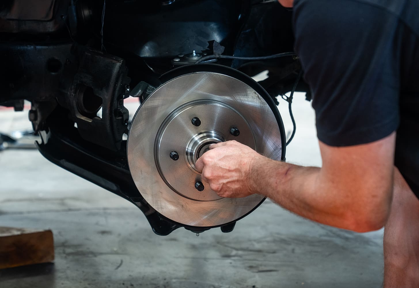 09 OBS Tahoe front disc brake rotor and hub freshly installed during suspension rebuild