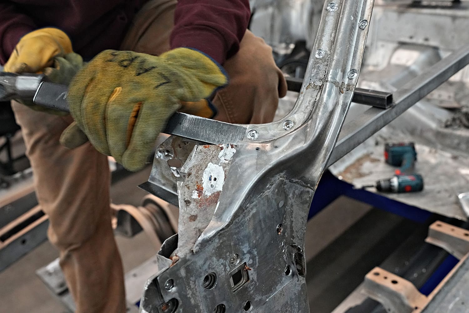 09 hand filing transition area between patch and original structure on 1971 challenger