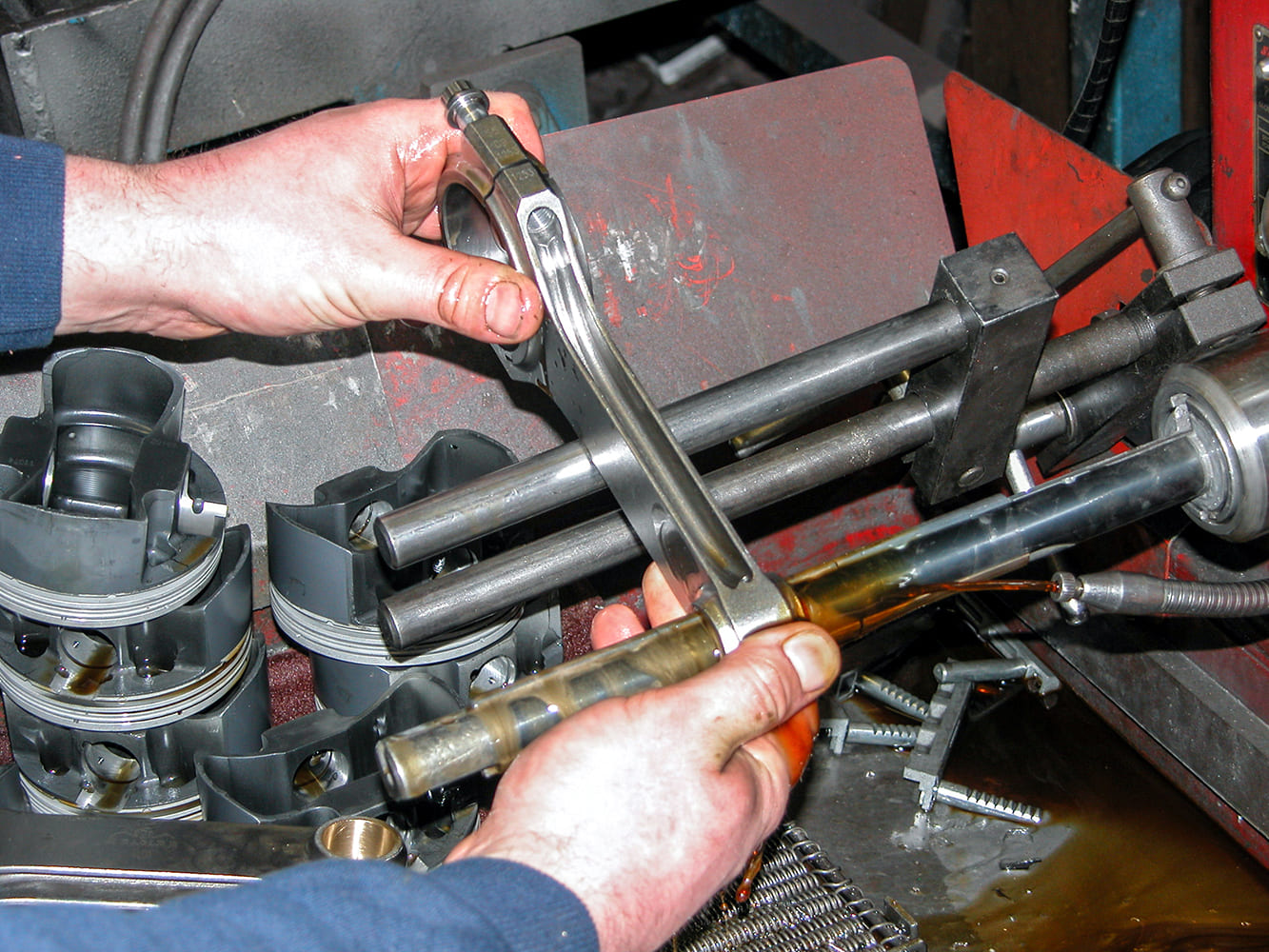 10 Pressing wrist pins into Pontiac 428 pistons using connecting rods for Tri Power setup