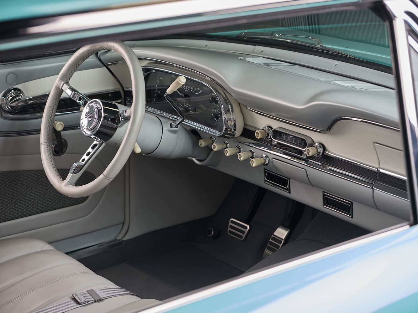 11 1963 Ford Falcon interior with two tone dash billet pedals and chrome accented HVAC vents