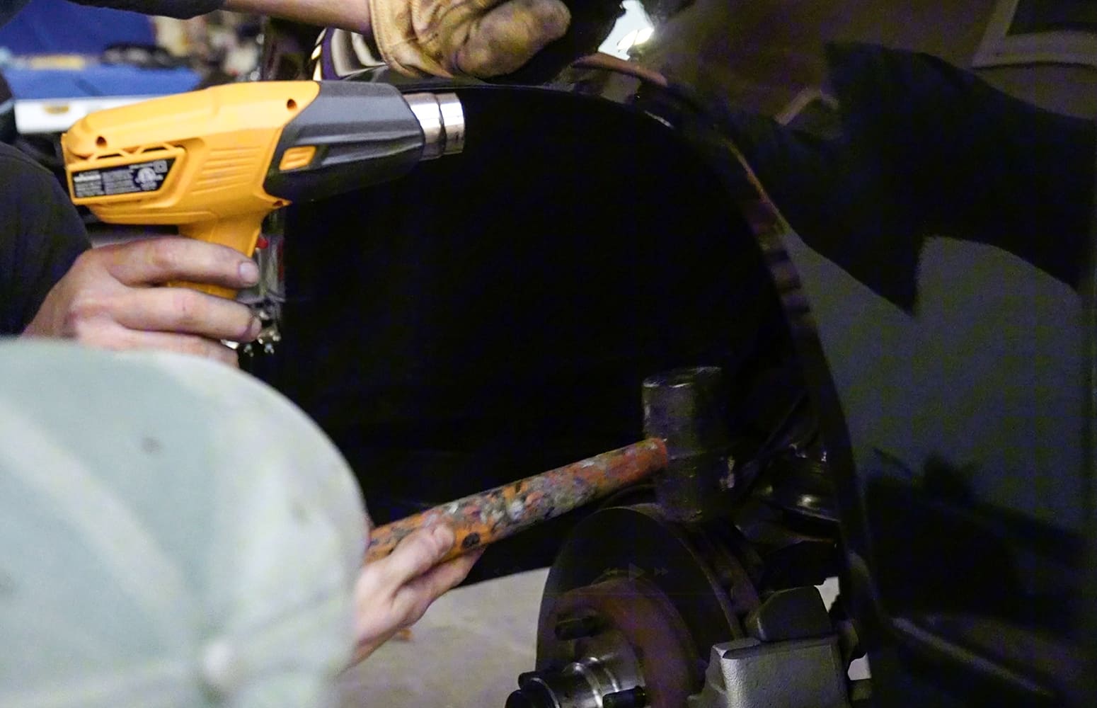 11 Fender lip gets heated and reshaped for clearance using a heat gun and mallet