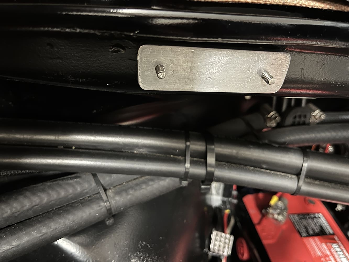 11 Mounting bracket installed on firewall for fan controller support and alignment