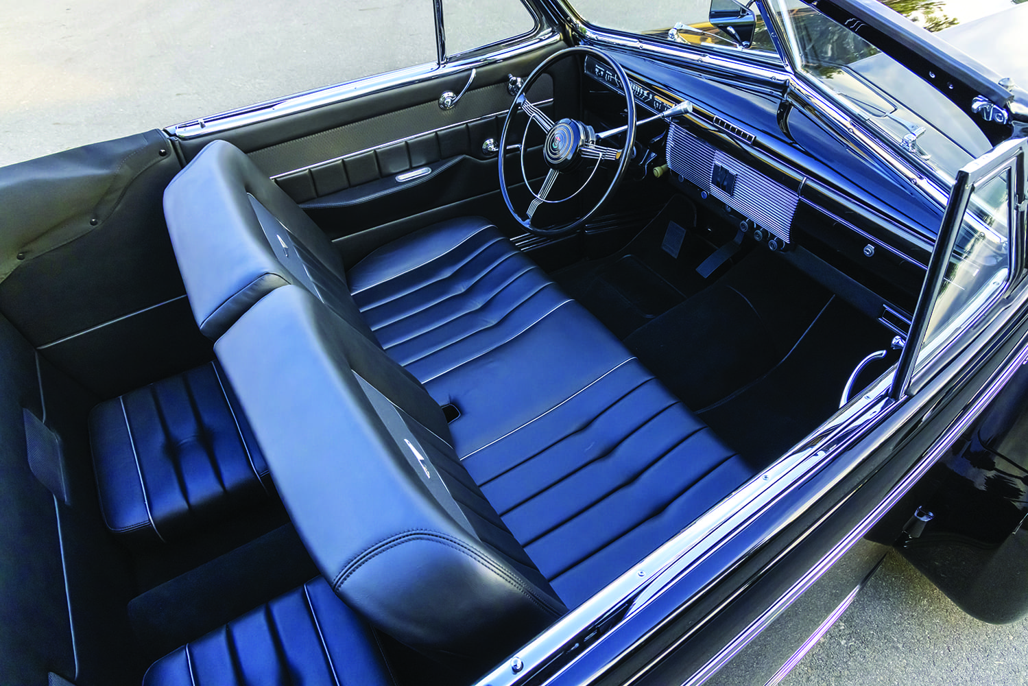 12 1939 Cadillac interior full cabin shot with black pleated seats and chrome trim