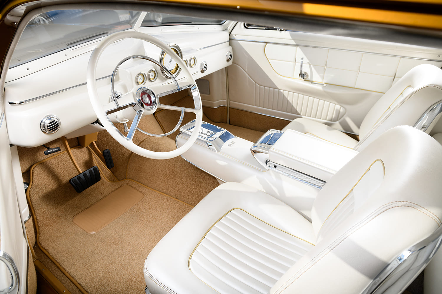 12 1951 Mercury Custom interior with white leather bucket seats and full length console
