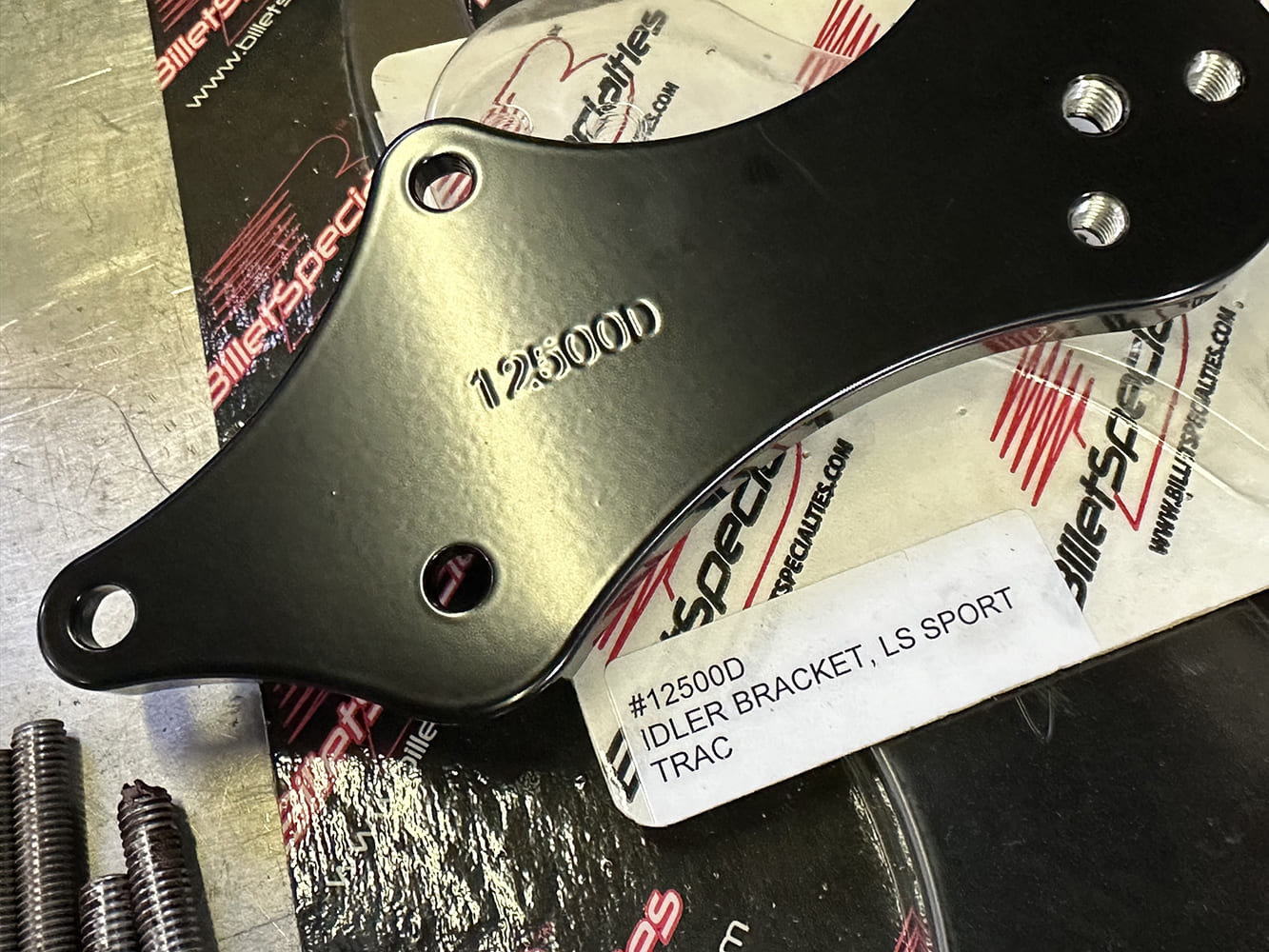 12 Close up of Billet Specialties #12500D idler bracket labeled for LS Sport Trac