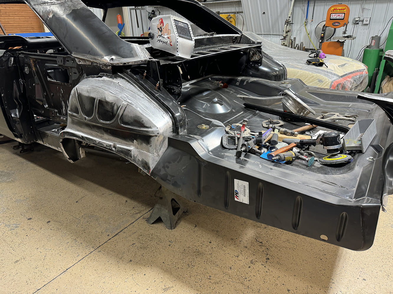 12 Inner wheelhouse and trunk area sanded bare on 1963 Ford Galaxie during panel fitting