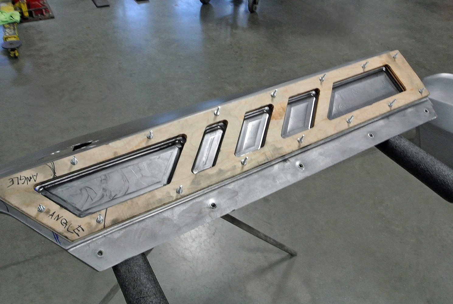 13 Final shaping of bead rolled insert vents into the fabricated cowl intake duct