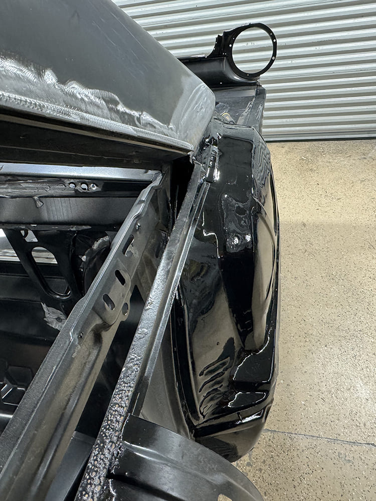 13 Rear corner bracing and weld seam prep on 1963 Galaxie with black epoxy frame rail