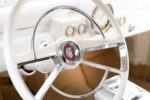 14 1951 Mercury Custom ivory steering wheel with chrome trim and Mercury crest center