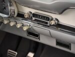 14 1963 Ford Falcon close up of vintage push button radio toggle knobs and chrome dash trim