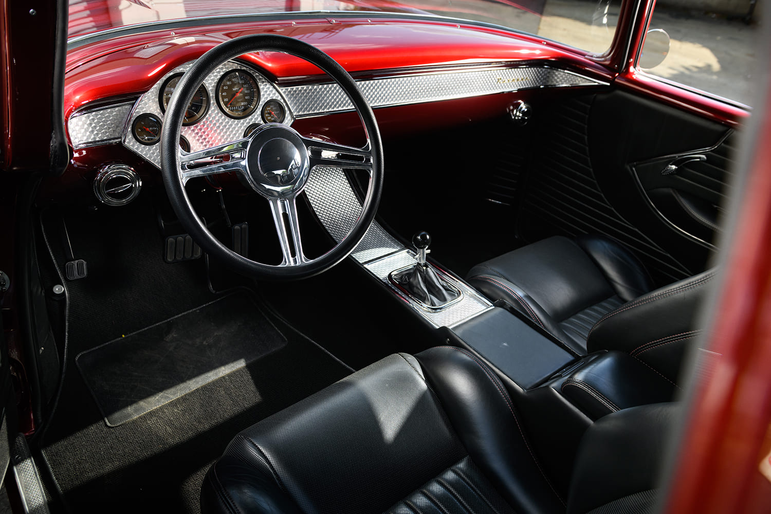 15 1955 Chevy classic car interior custom dashboard red black leather seats chrome trim custom gauges hot rod restomod steering wheel manual transmission shifter