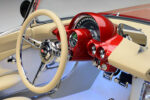15 1962 Corvette sports a split spoke steering wheel with cross flags emblem and satin wrap