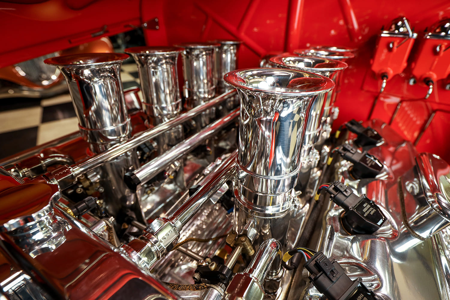 16 1932 Ford Roadster close up polished velocity stacks fuel rails