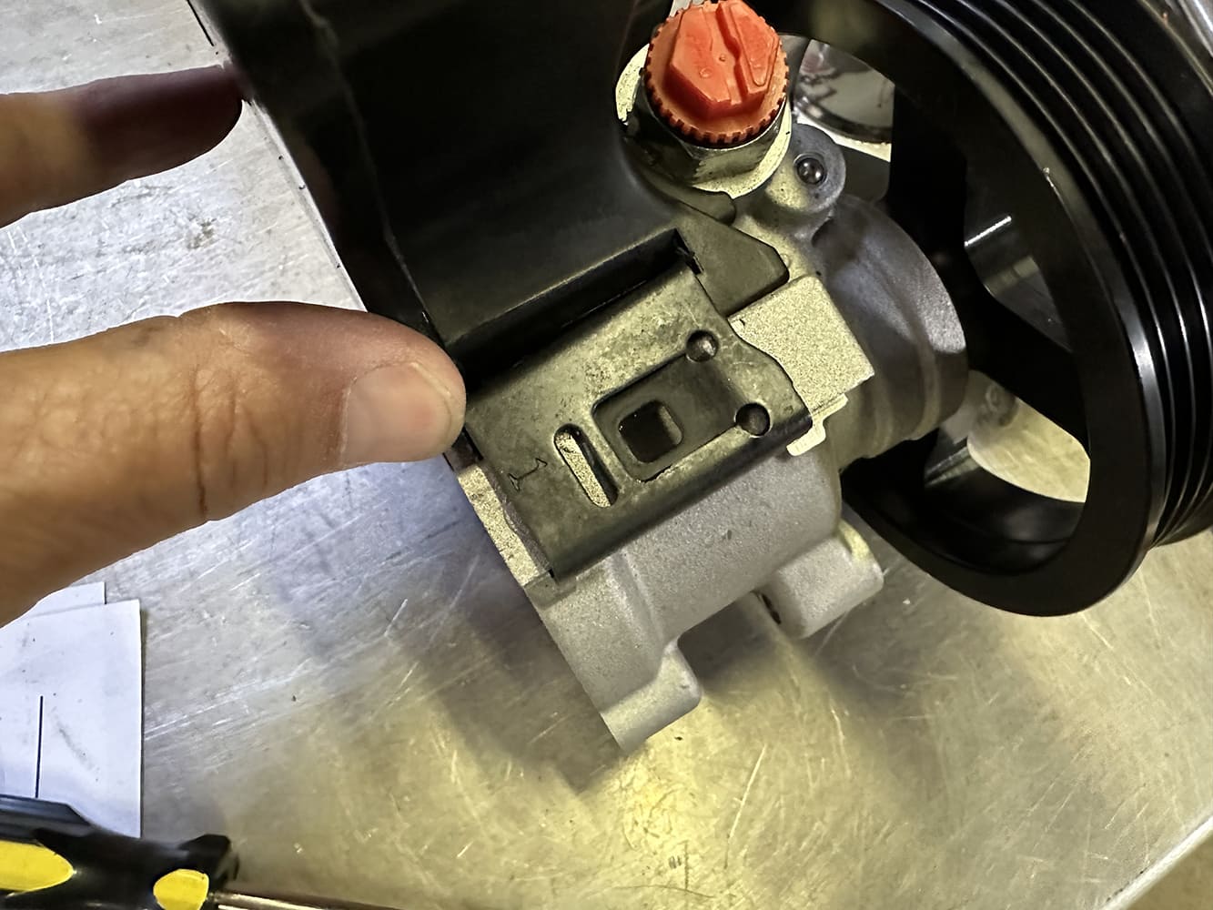 16 Sanden SD7 AC compressor shown with mounting tab clearancing for billet bracket