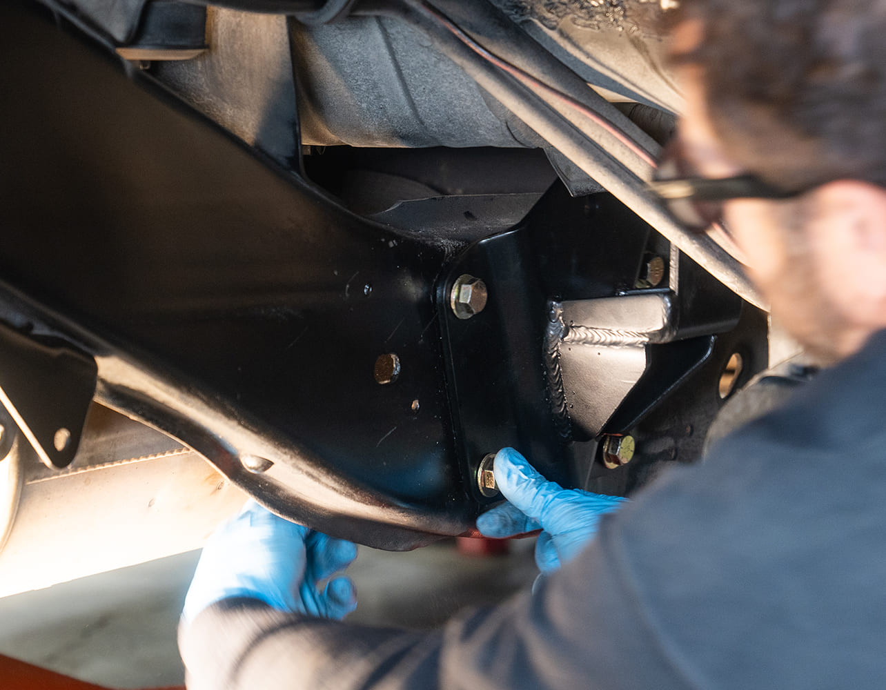 16 Stock versus DJM Suspension notch bracket shows upgraded strength and design