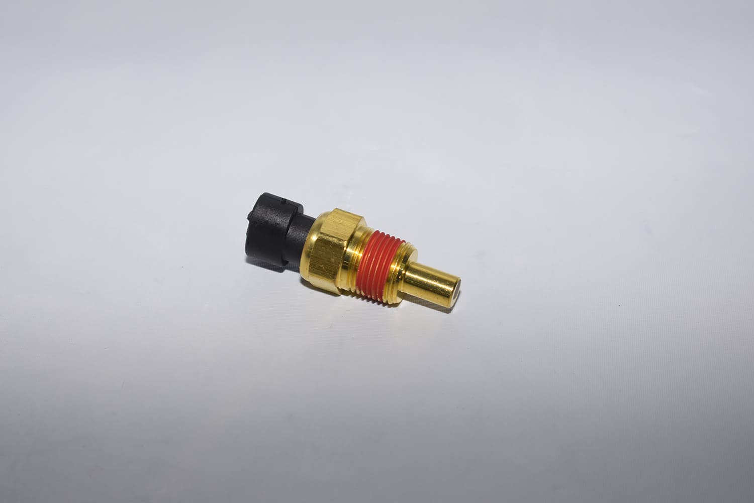 17 Brass FiTech coolant temperature sensor with red thread sealant for accurate engine monitoring