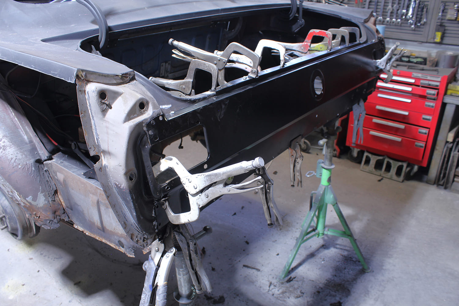 17 fitting and clamping new tail panel on 1965 mustang