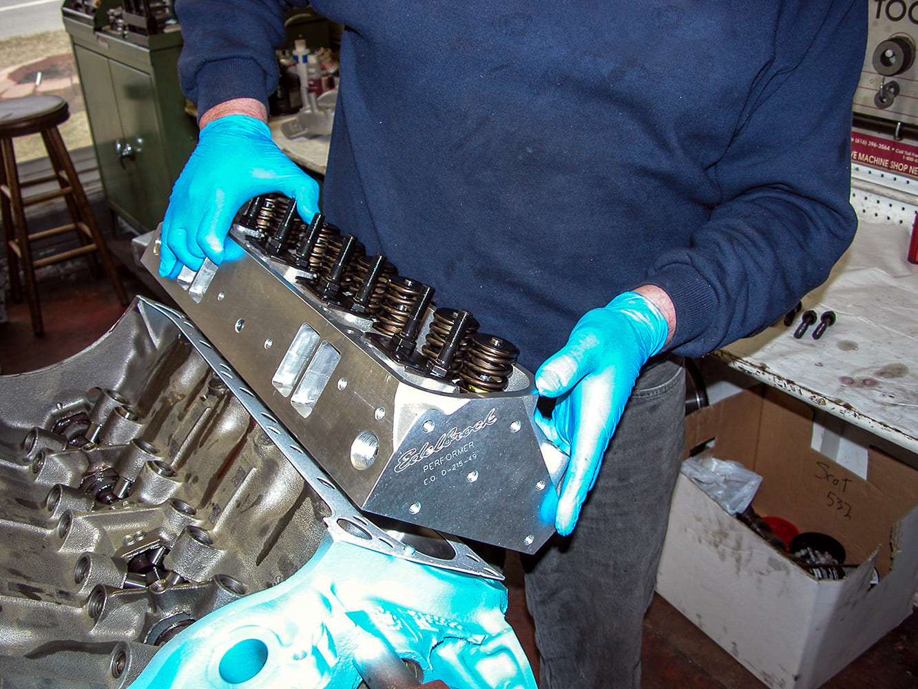 18 Edelbrock head positioned onto Pontiac 428 block matching performance with reliability