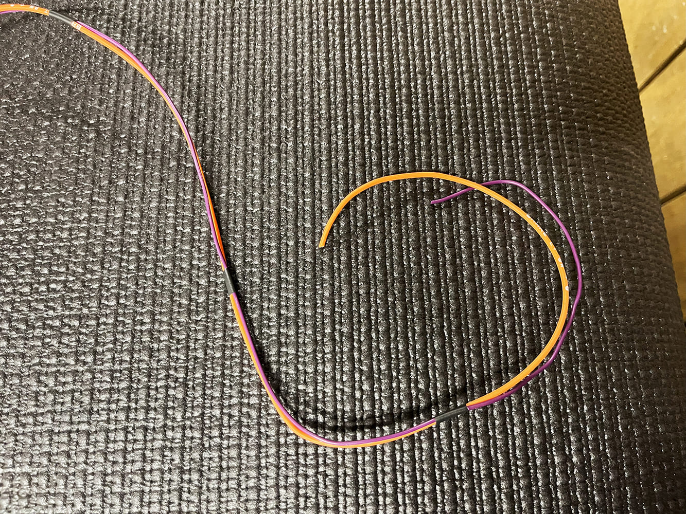 18 Orange and purple wires prepared for inline connection in fan circuit harness