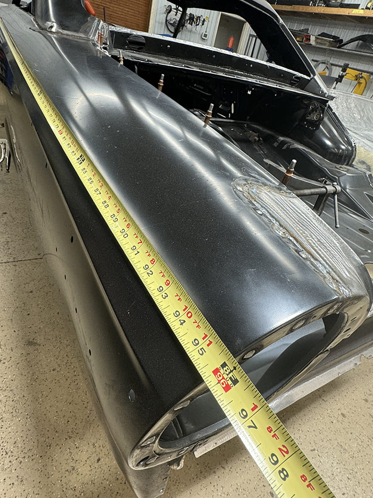 18 Tape measuring fitment on new 1963 Ford Galaxie quarter panel during mock up