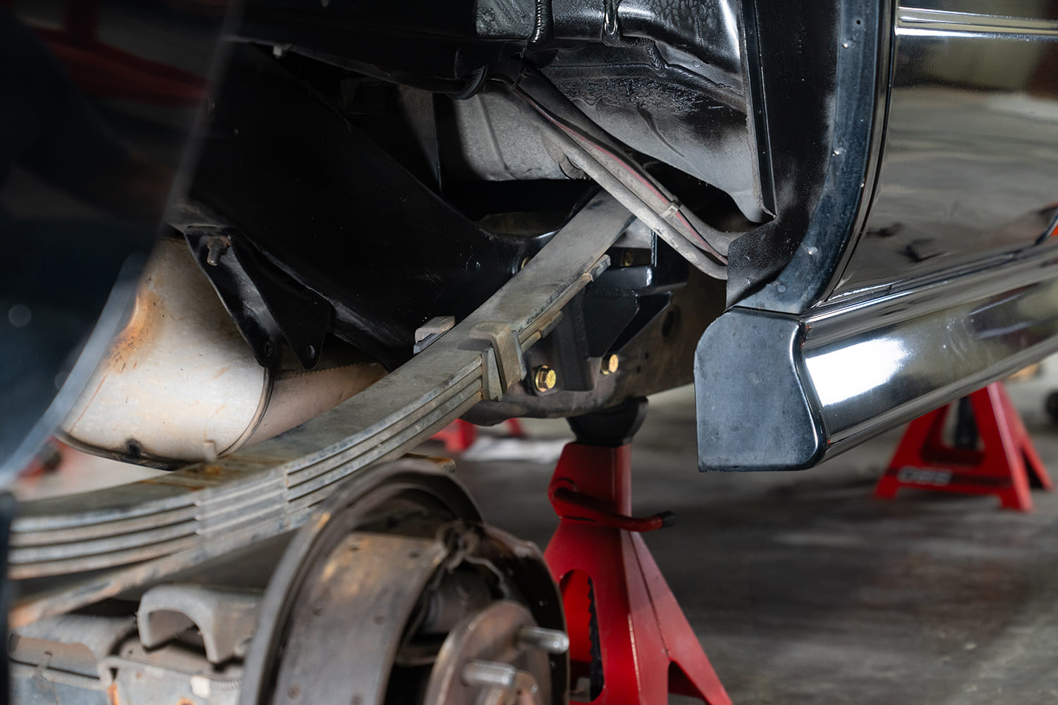 18 Technician fits exhaust clearance around frame as rear notch work progresses
