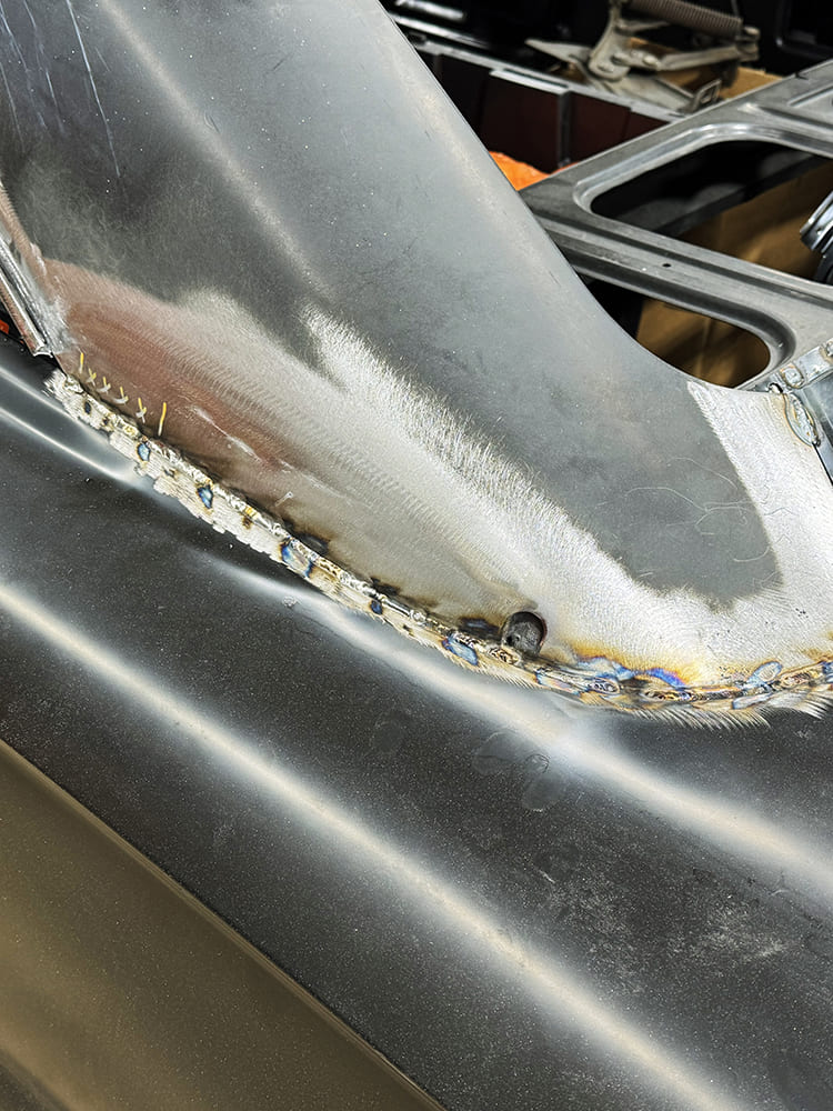 19 Seam weld and grind work along sail panel into quarter on 1963 Galaxie coupe