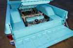 22 1973 Chevy C10 raised bed floor reveals air suspension setup with custom cover
