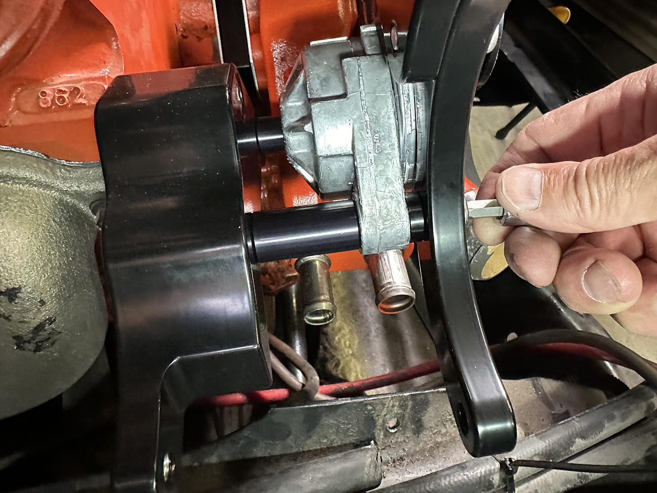 22 Power steering pump mounted using spacers between Billet Specialties bracket legs