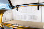 23 1951 Mercury Custom trunk interior trimmed in white vinyl and tan carpet to match cabin