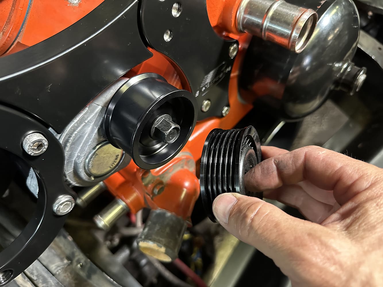 23 Idler pulley and crank driven pulley being aligned for belt routing on LS block