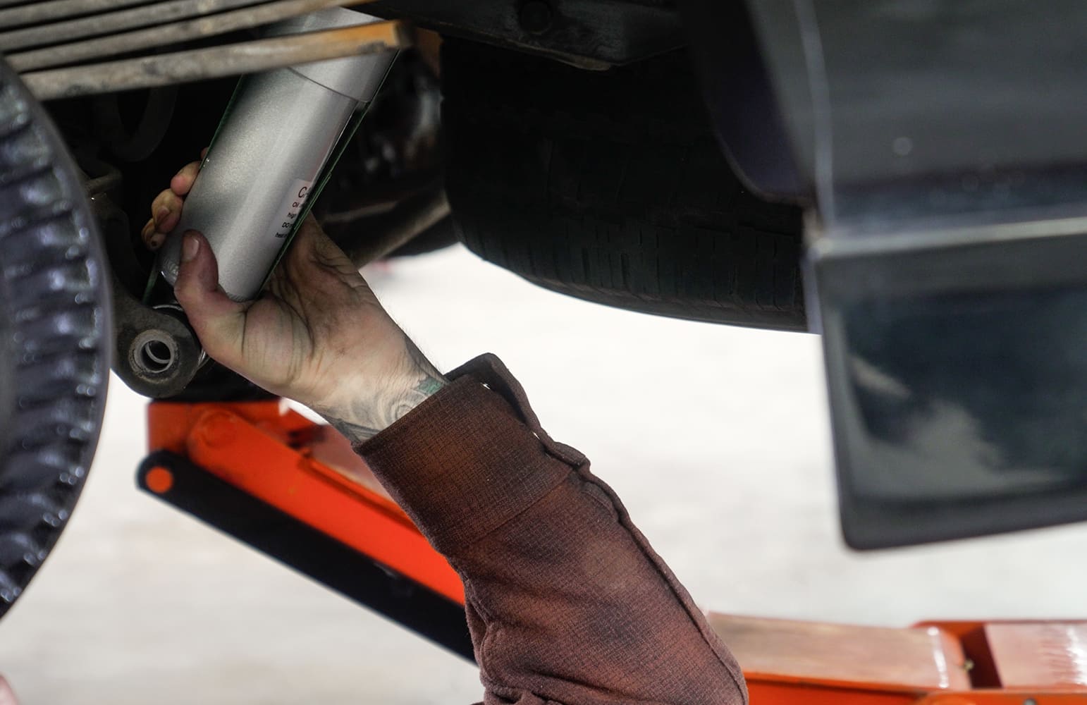 23 New rear shocks being installed to match lowered ride height