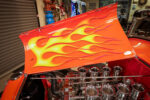 25 1932 Ford Roadster flame painted hood open over velocity stacks