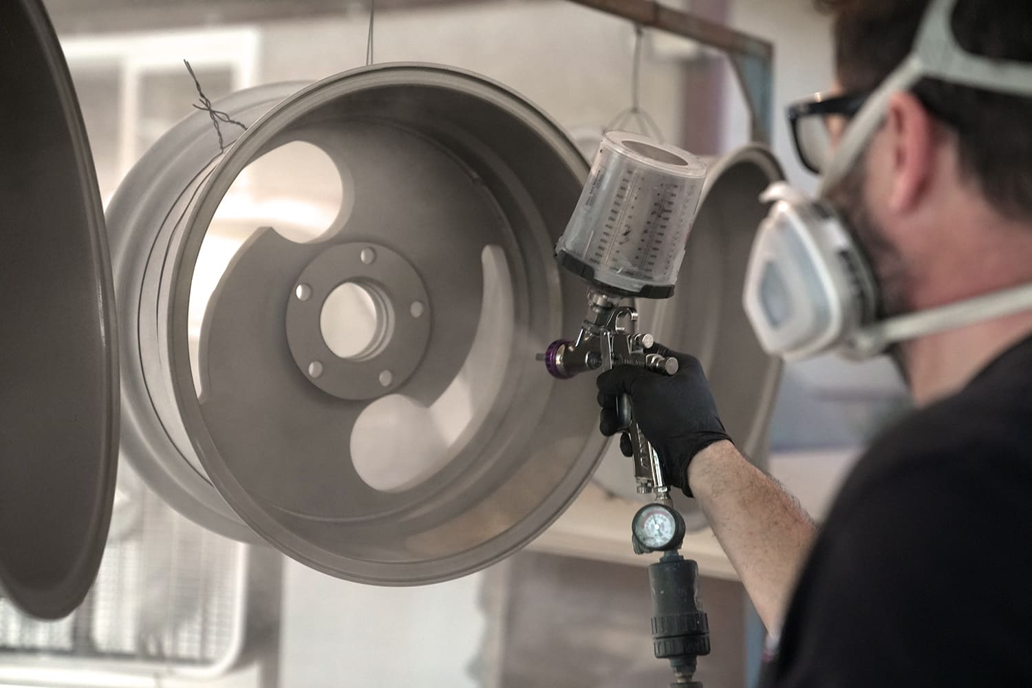 29 Fresh Cerakote being sprayed onto Slater wheels for a modern satin look
