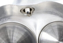 000 Close up of a spark plug indexed perfectly toward the intake valve in a CNC machined aluminum combustion chamber