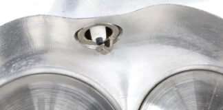 000 Close up of a spark plug indexed perfectly toward the intake valve in a CNC machined aluminum combustion chamber