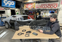 000 Technician preps a 1971 Camaro dash and gauge cluster for install wiring harnesses laid out for final fitment