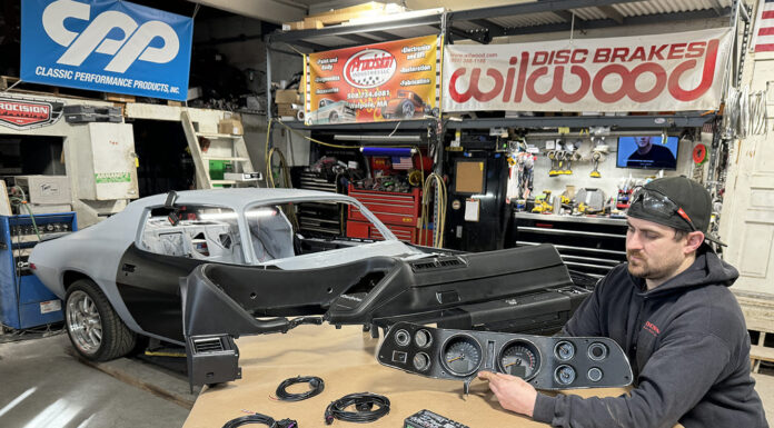 000 Technician preps a 1971 Camaro dash and gauge cluster for install wiring harnesses laid out for final fitment