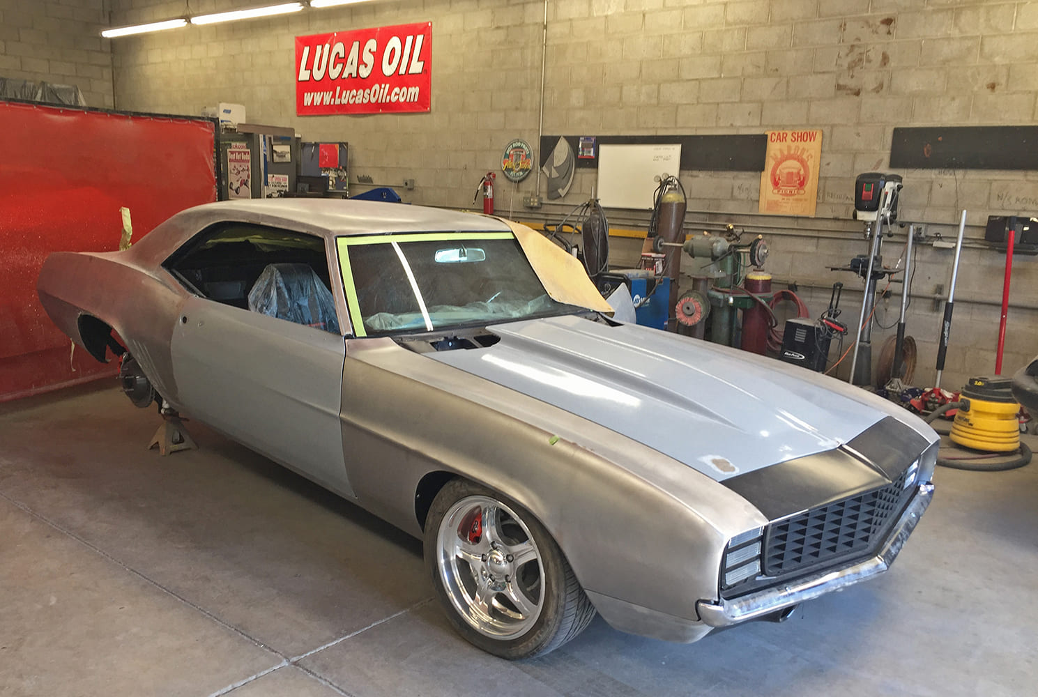 001 1969 Camaro in bare metal with mocked up body panels and custom wheels awaiting fitment