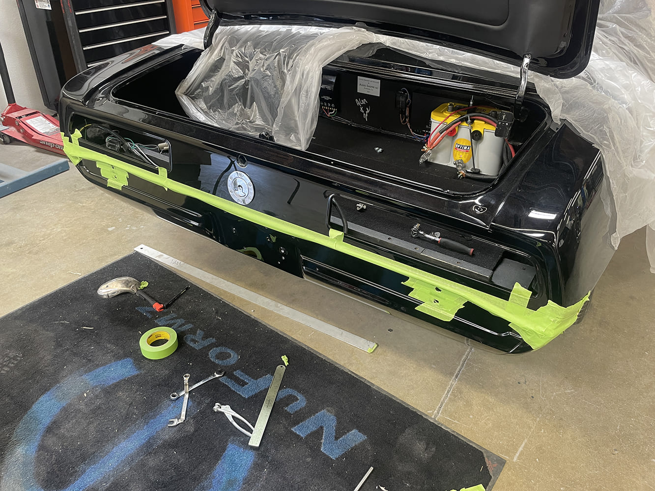 002 1969 Camaro trunk open during bumper tuck prep with Optima YellowTop battery mounted inside