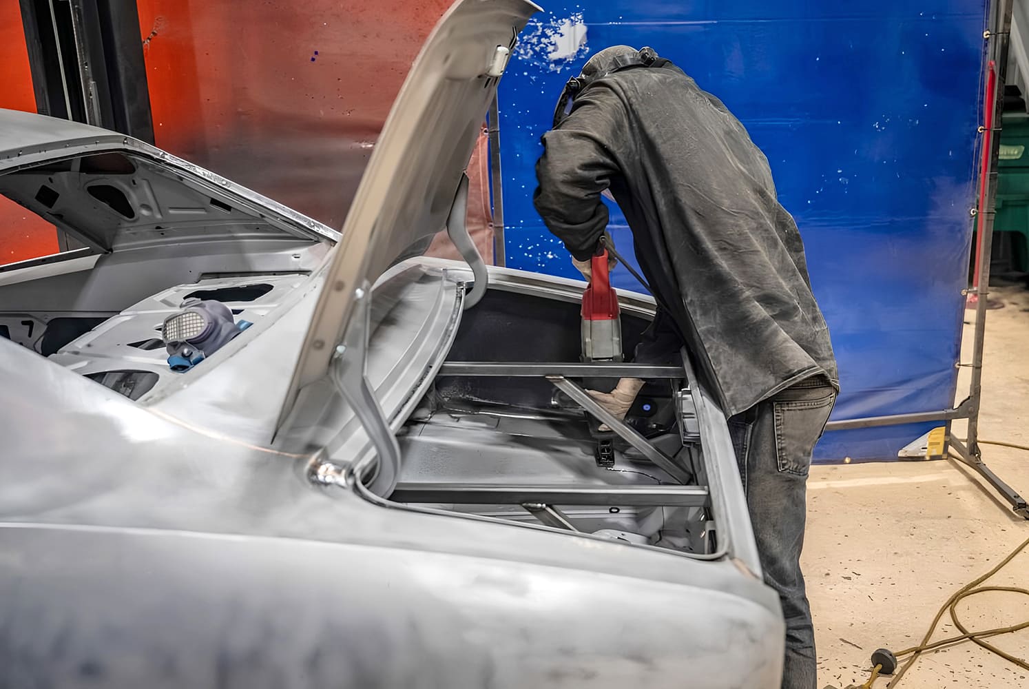 004 1968 Camaro trunk bracing being installed with a power tool during restoration