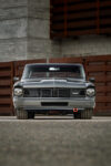006 1966 Chevy Nova front end features billet badge and sleek headlight bezels