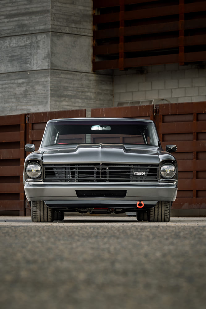 006 1966 Chevy Nova front end features billet badge and sleek headlight bezels