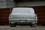 008 1966 Chevy Nova rear view highlights tucked exhaust and custom tail light lenses