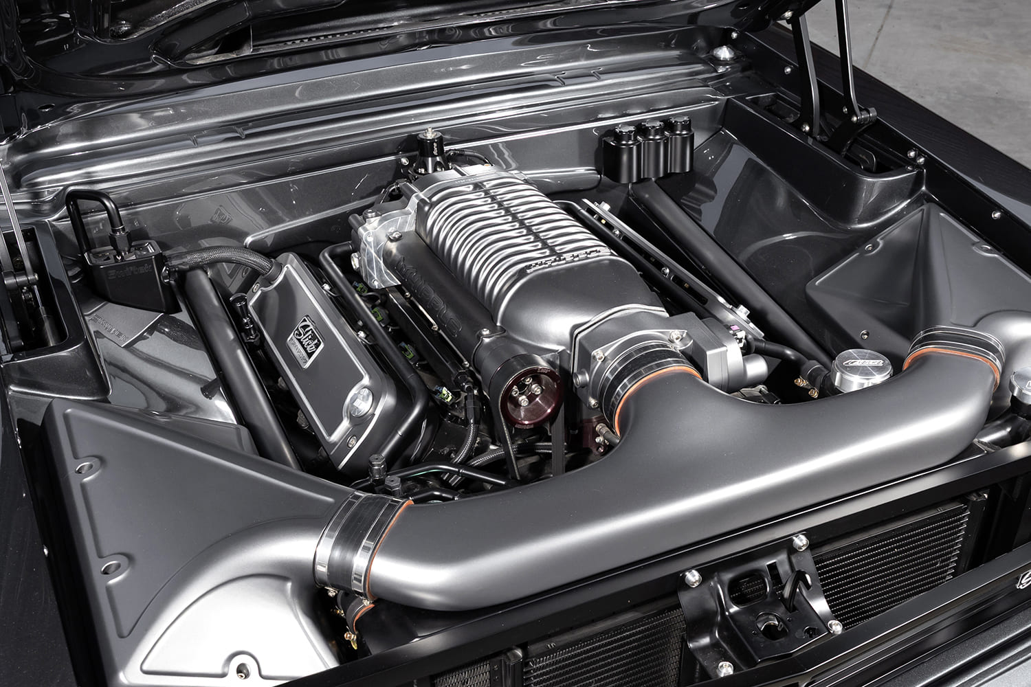 009 1966 Chevy Nova engine bay with Whipple supercharger and custom intake ducting
