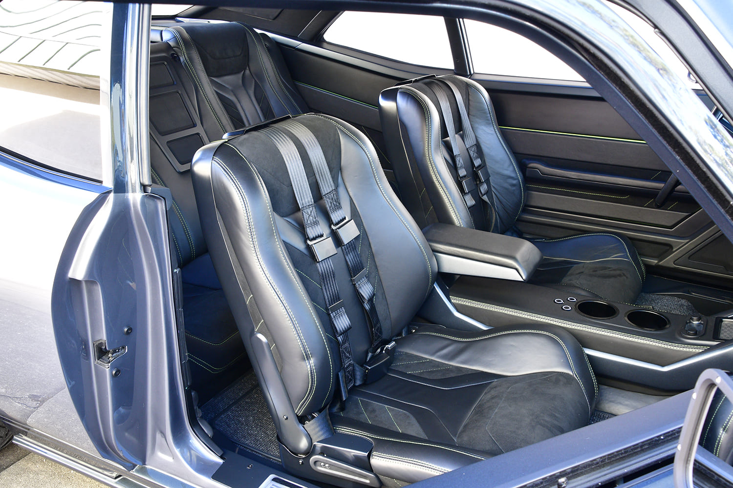 010 1968 Chevy Nova race style leather seats with neon stitching and full harness setup