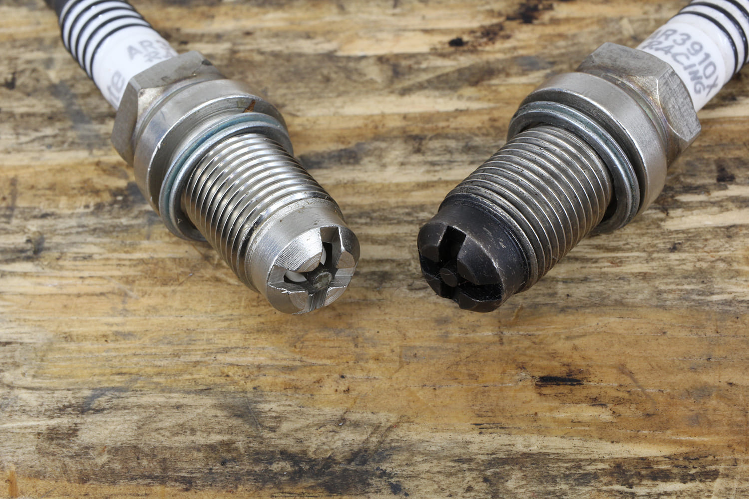 011 Pair of racing style spark plugs with four ground electrodes for improved combustion stability and extended durability
