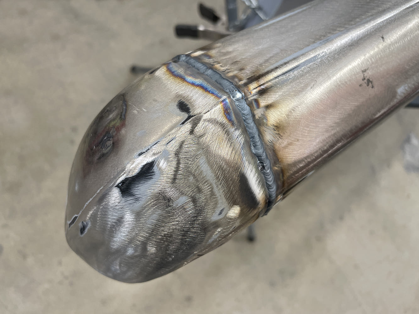 012 1969 Camaro bumper corner TIG welded and heat discolored ready for post weld finishing